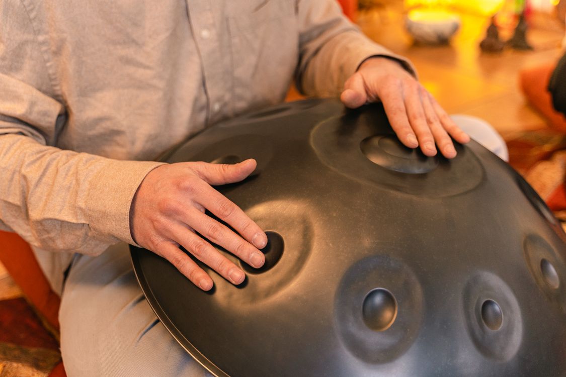 Close-Up Shot of a Person Using a Handpan · Free Stock Photo