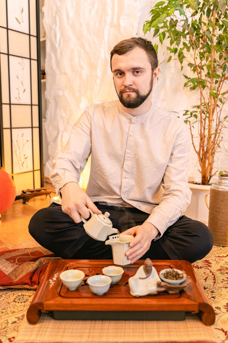 Man Pouring Tea