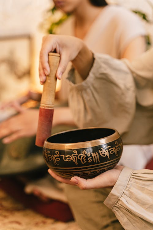 Free Person Holding a Tibetan Singing Bowl Stock Photo