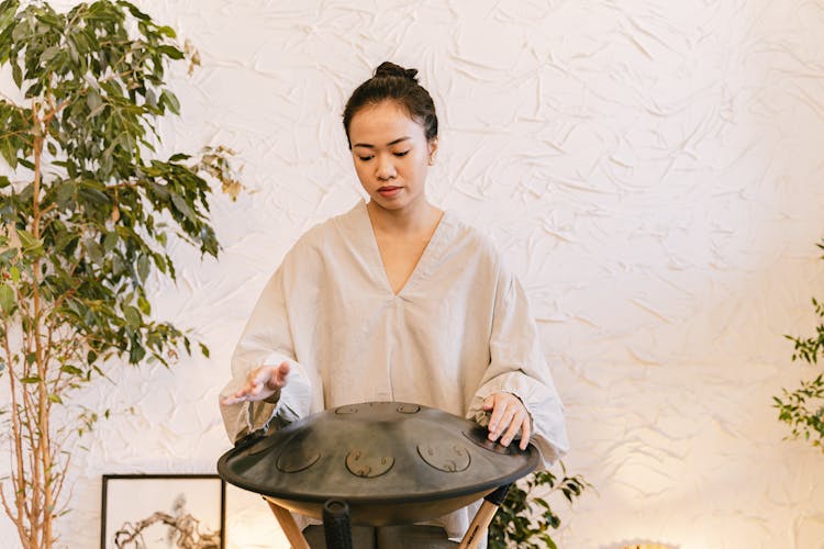 Woman Playing Hung Drum