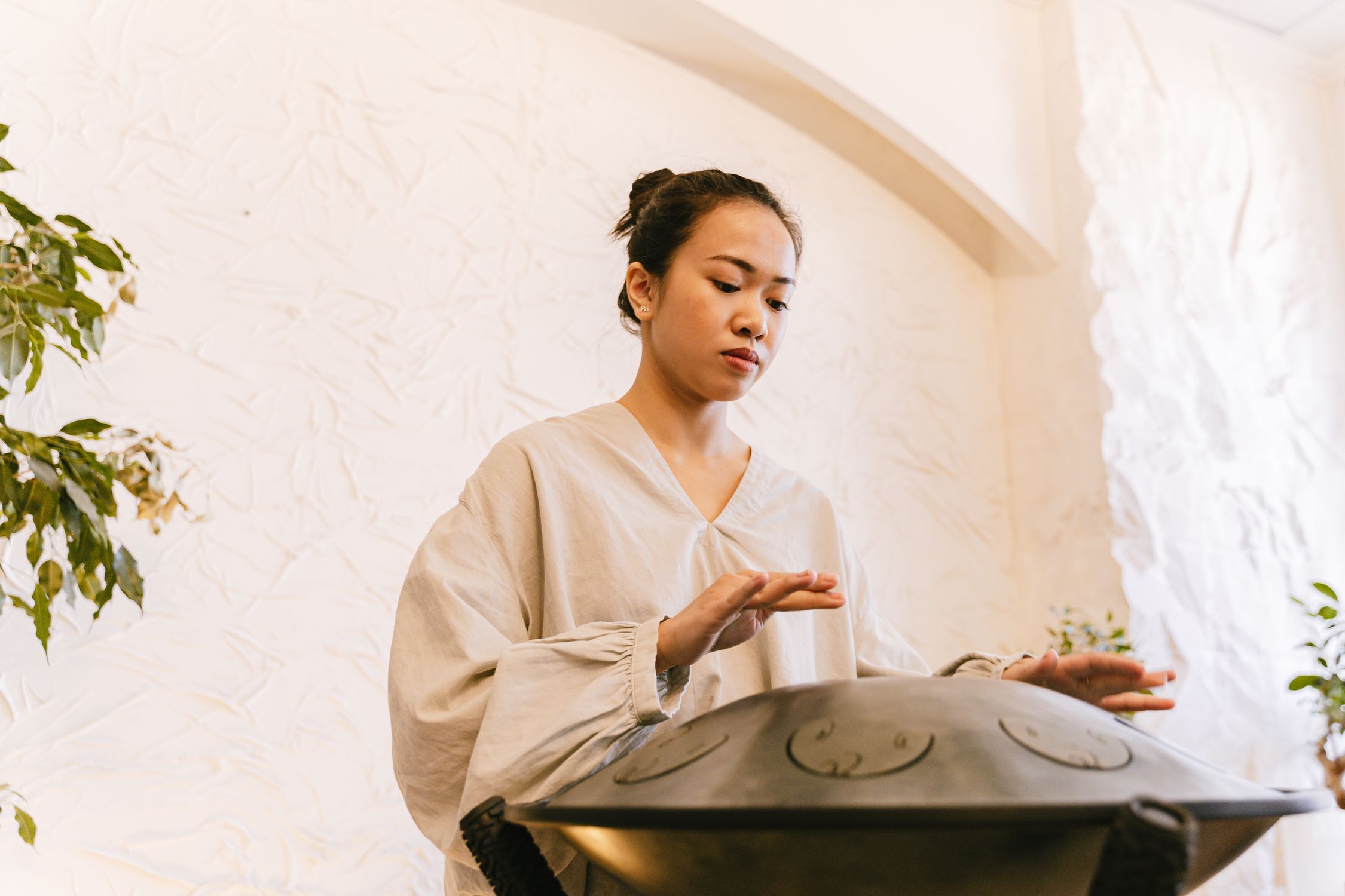 A Woman Using a Handpan · Free Stock Photo