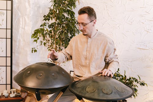 Free Photo of a Man Playing Percussion Instruments Stock Photo