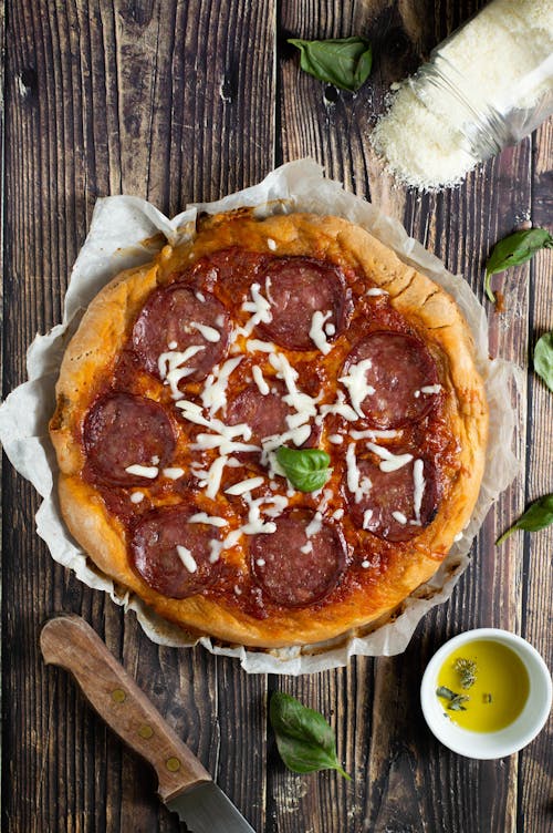 Pizza on Brown Wooden Table