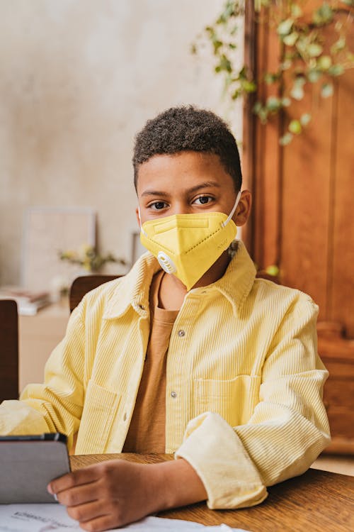 Boy Wearing Yellow Face Mask