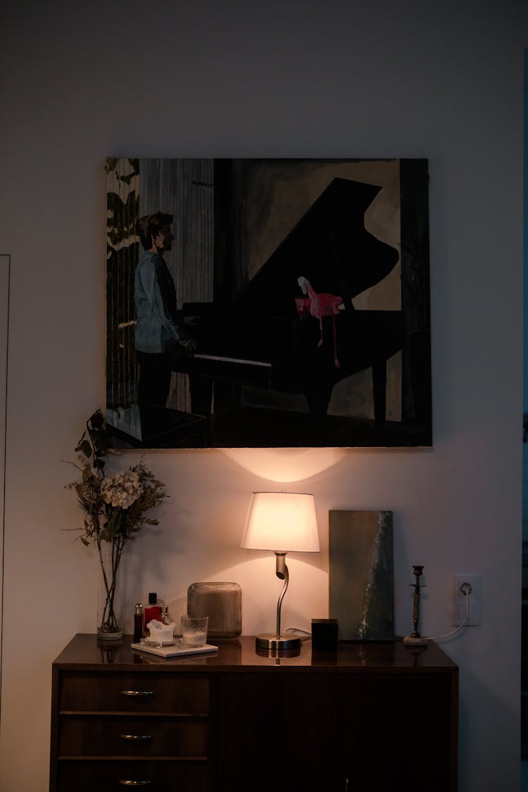 A Desk Table Under A Beautiful Painting