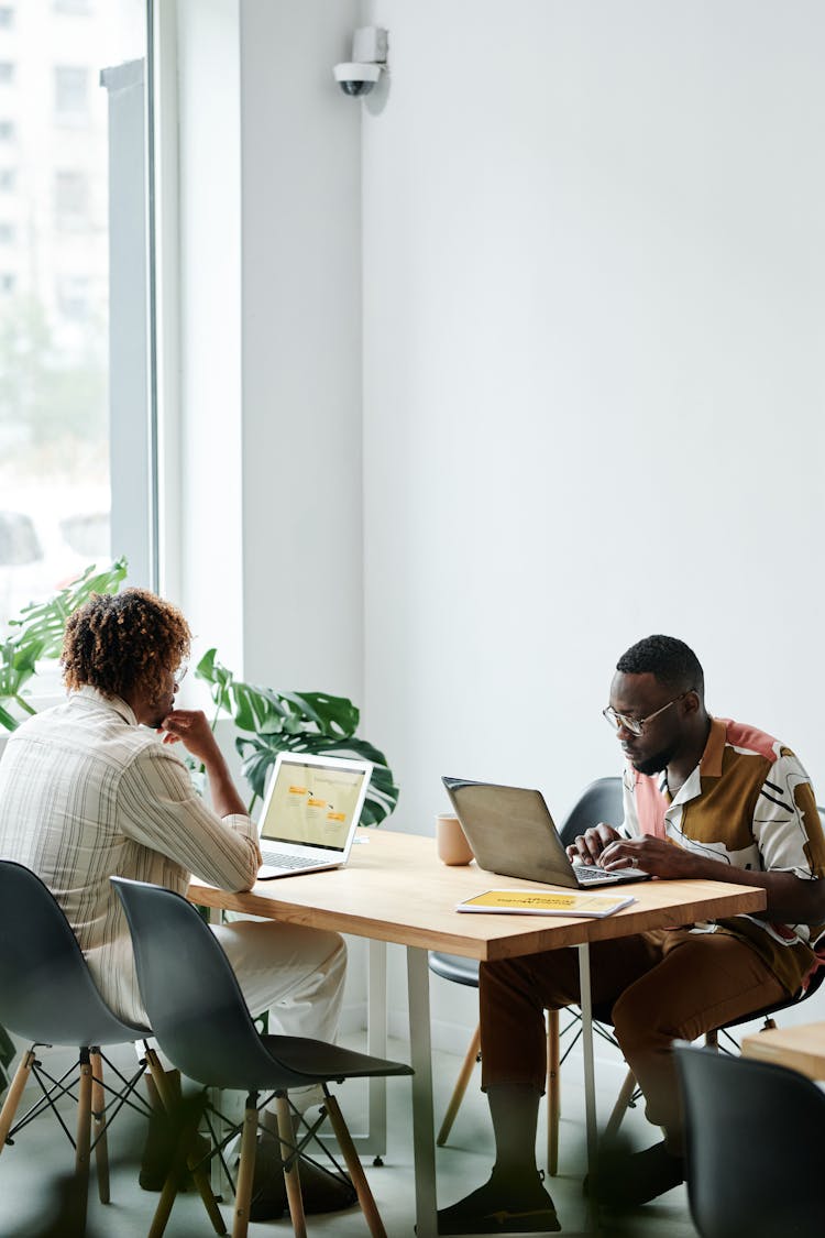 Men Using Laptops In The Office