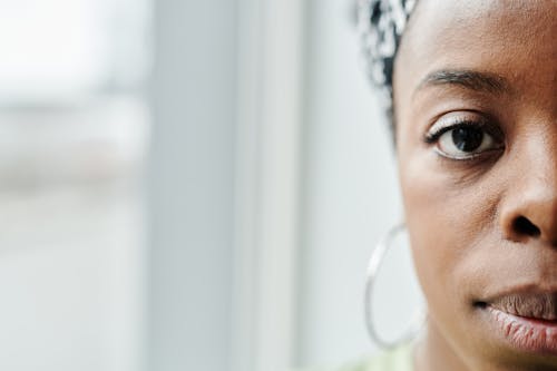 Close-Up Shot of a Woman Looking at Camera