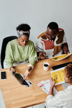 Top view of colleagues in a dynamic business meeting discussing ideas.