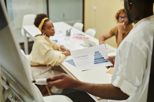 Three colleagues engaged in a collaborative discussion during a business meeting.
