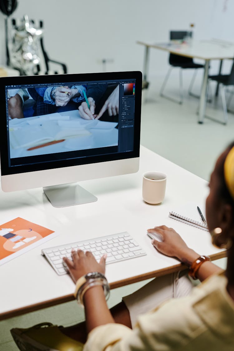 A Person Using An IMac