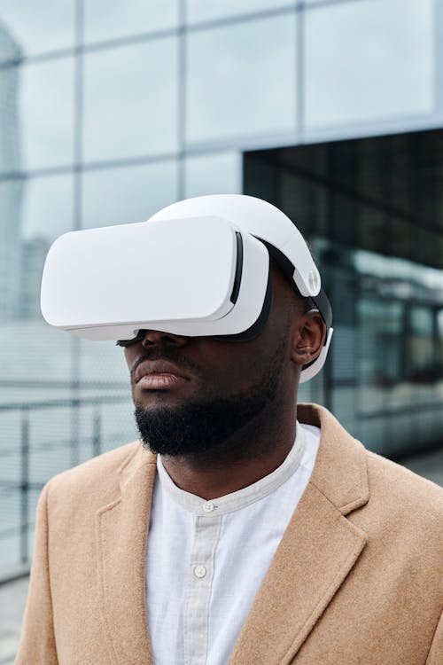 Man in Brown Blazer Wearing Virtual Reality Headset
