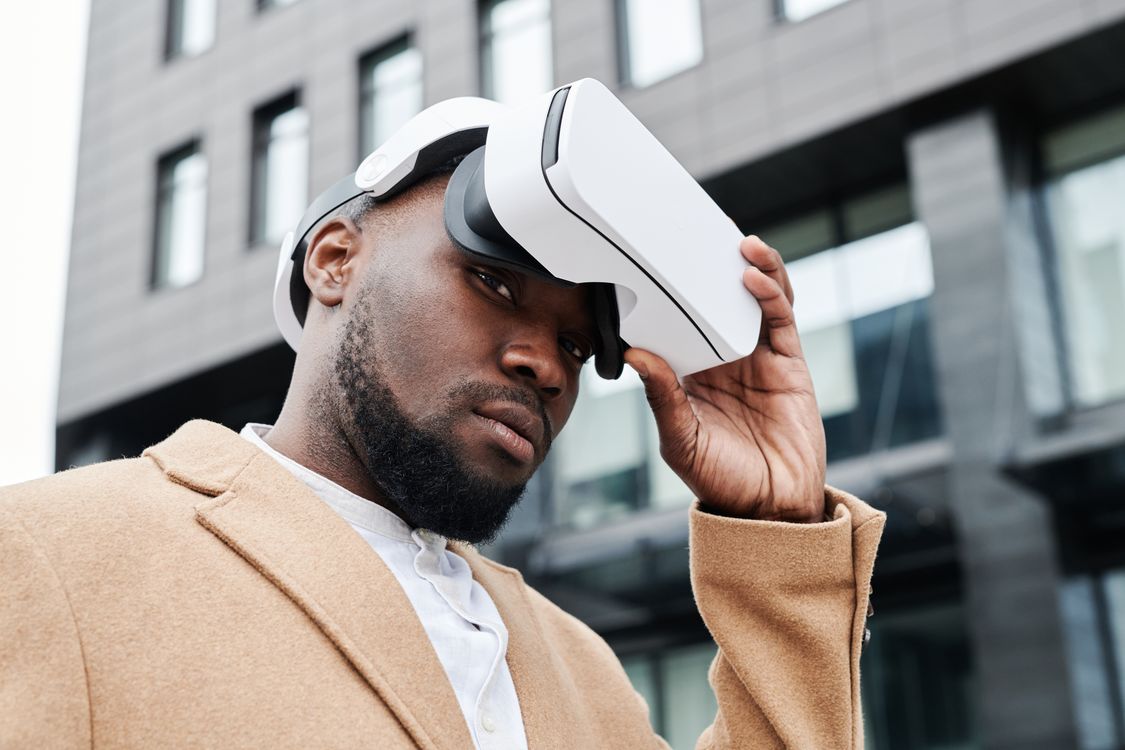 Human Using Virtual Headset Man Wearing a Virtual Reality Headset ยท Free Stock Photo