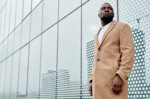 Free Photo of a Handsome Man in a Brown Coat Looking Away Stock Photo