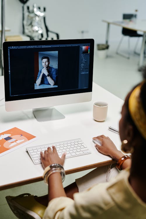 A Woman Using a Computer · Free Stock Photo