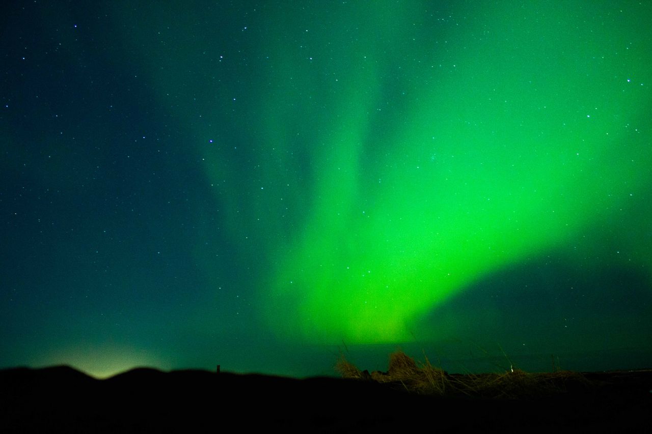 dazzling display of aurora borealis under a starry night sky perfect f