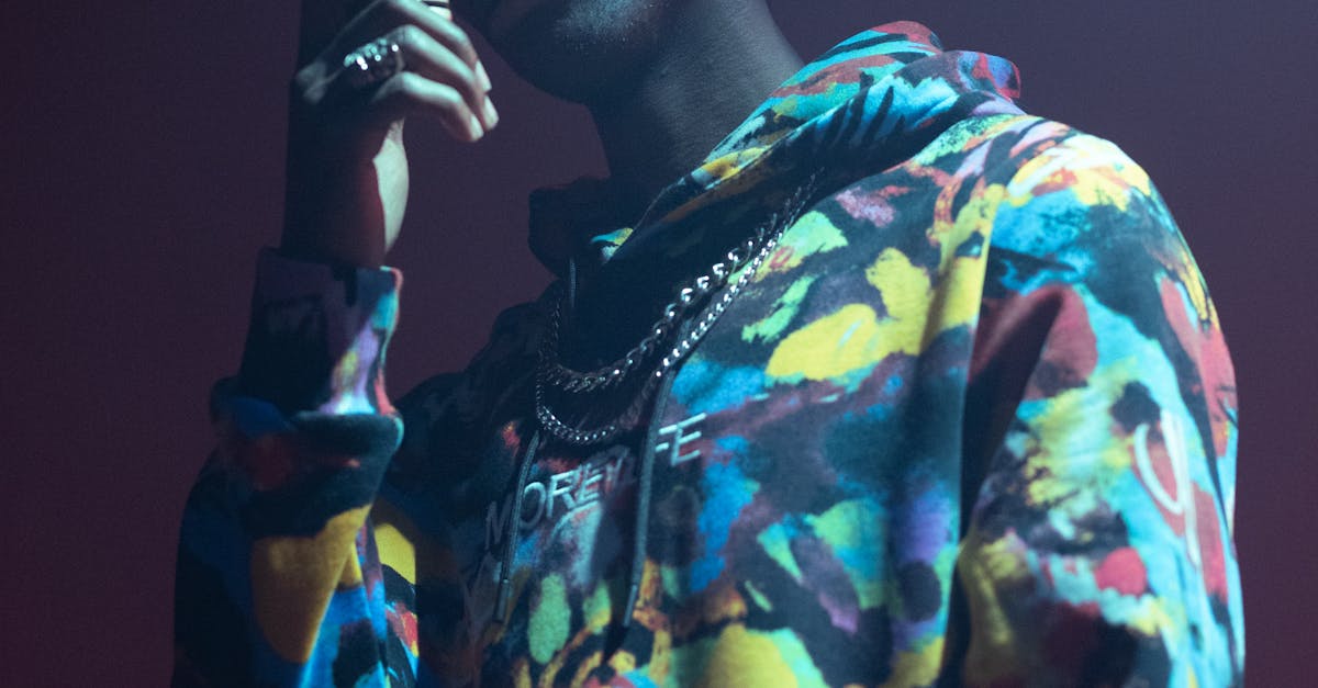 Rapper Holding Microphone in Hand at Concert · Free Stock Photo