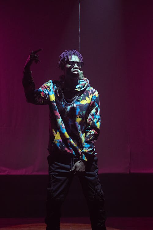 A Rapper Performing on Stage · Free Stock Photo