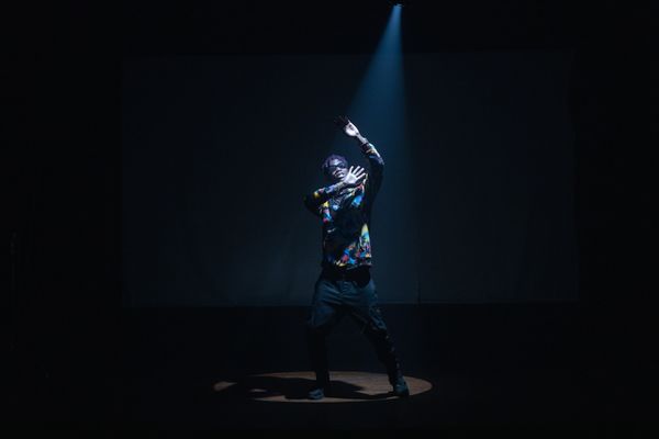 Portrait of studio manager Marcus Webb under a spotlight