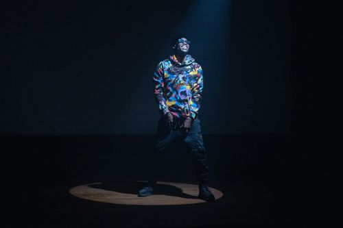 Rapper in Hoodie Standing on Stage · Free Stock Photo