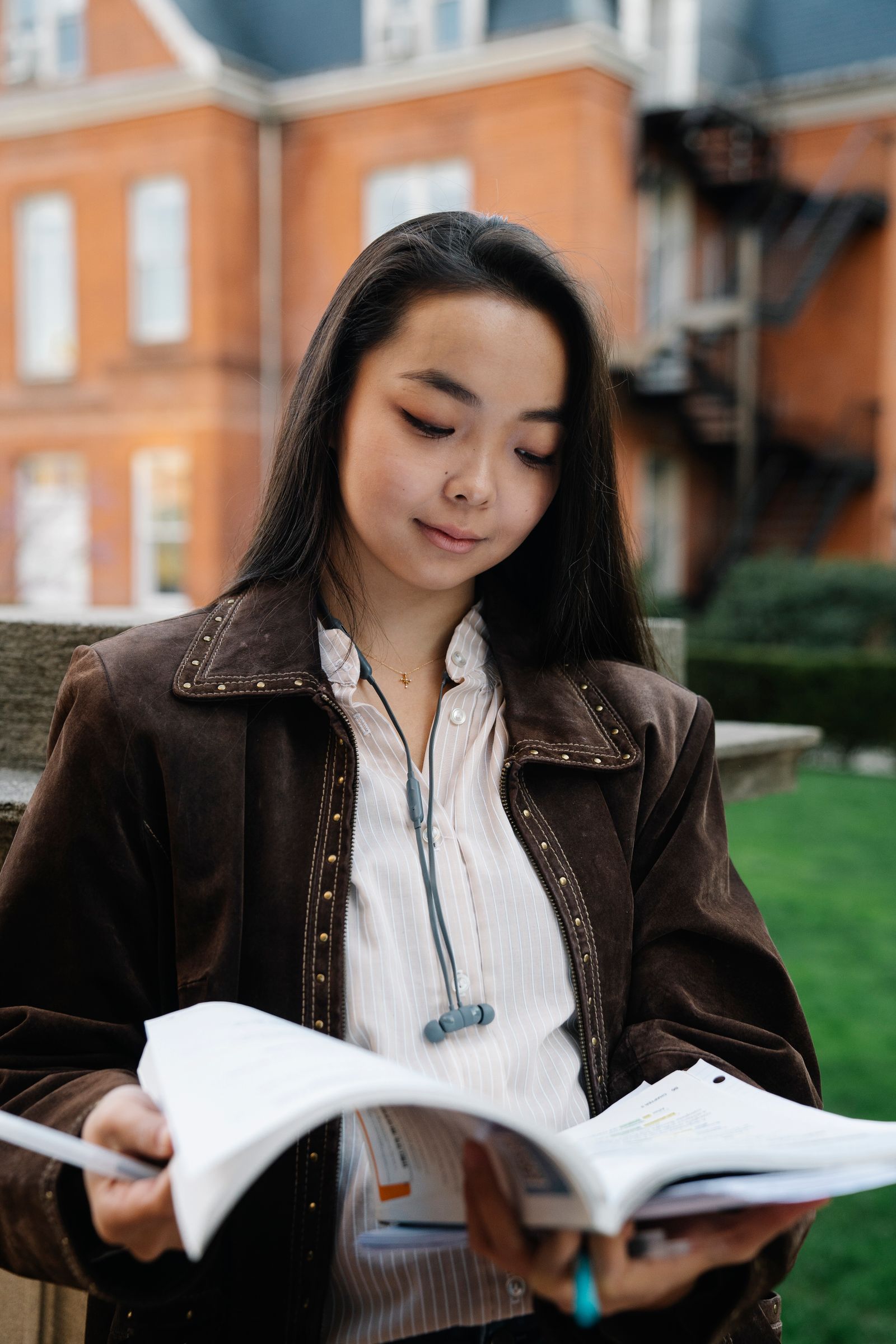 Student reading on the University of Alberta campus in Edmonton