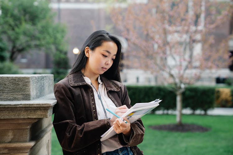 A Woman Studying Papers