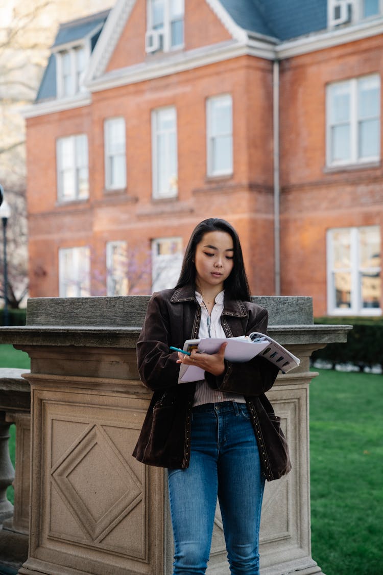 A Woman Studying Papers