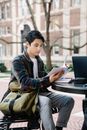Man in Blue and Black Plaid Dress Shirt Using Black Laptop Computer