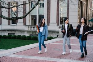 Students walking across campus — photo by George Pak on Pexels