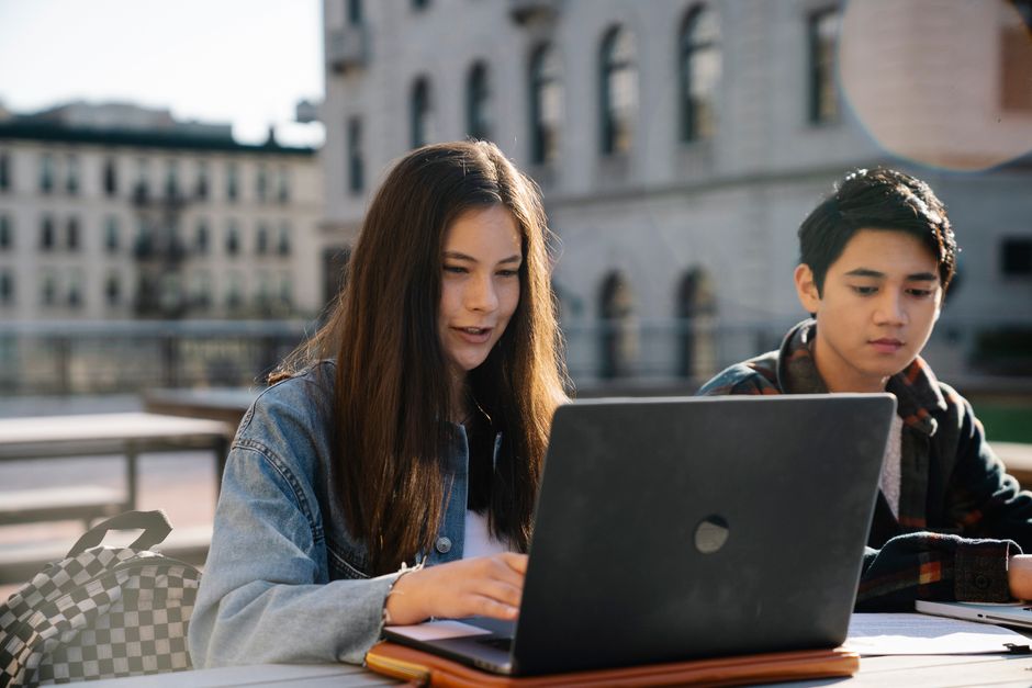 student using a laptop to submit documents for an insurance claim - student study abroad insurance claim process student using a laptop to submit documents for an insurance claim - student study abroad insurance claim process