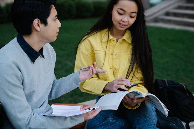 College Girl And Boy Studying Together 