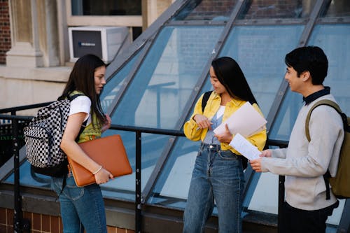 Photograph of a Group of Students Talking with Each Other