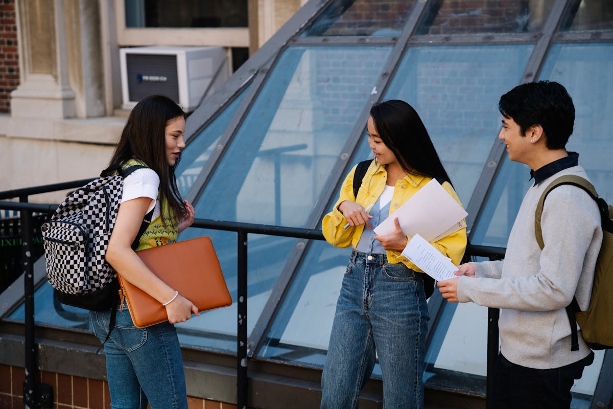 University students talking on campus steps