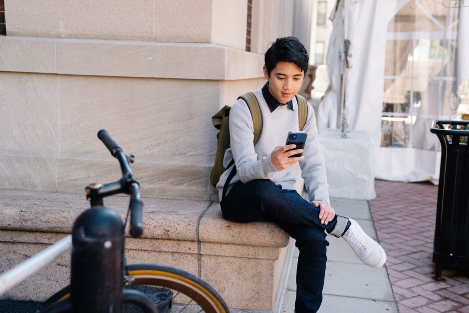 young adult using a digital round-up app to save spare change - emergency fund for young people young adult using a digital round-up app to save spare change - emergency fund for young people