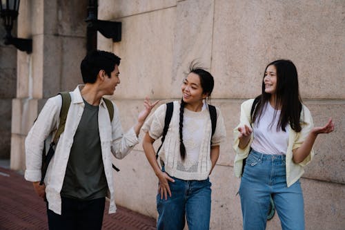 Free Photo of a Group of Friends Talking while Walking Stock Photo