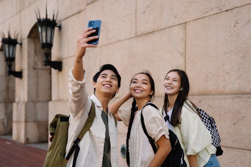 Photo of a Group Smiling while Taking a Groupie