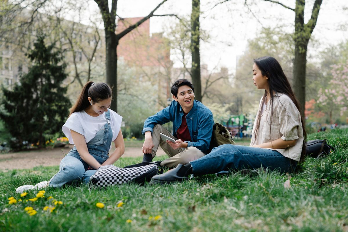 Supportive group of people sitting together outdoors