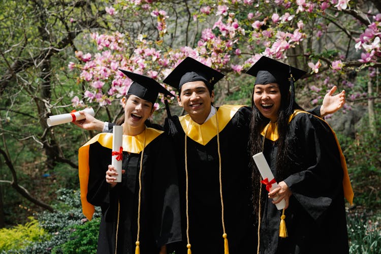 Man And Women In Graduation Clothing