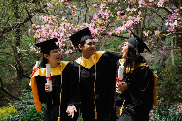 Photograph Of A Group Of Friends Celebrating Their Graduation