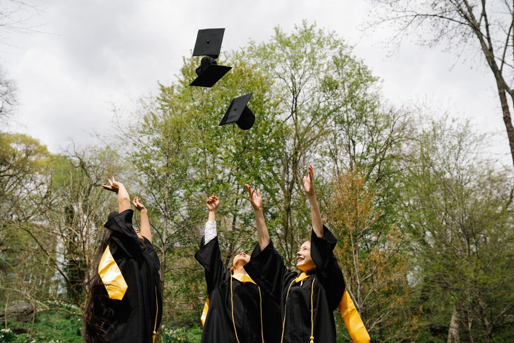 Graduates throwing their caps in the air