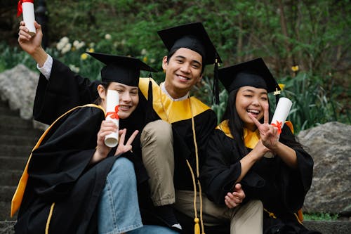 Students During Graduation Holding Their Diplomas · Free Stock Photo