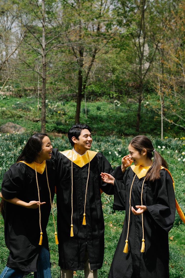 Group Of Friends In Graduation Gowns 