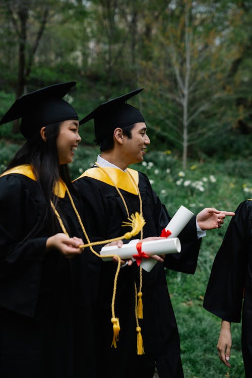 Students in Graduation Gowns · Free Stock Photo