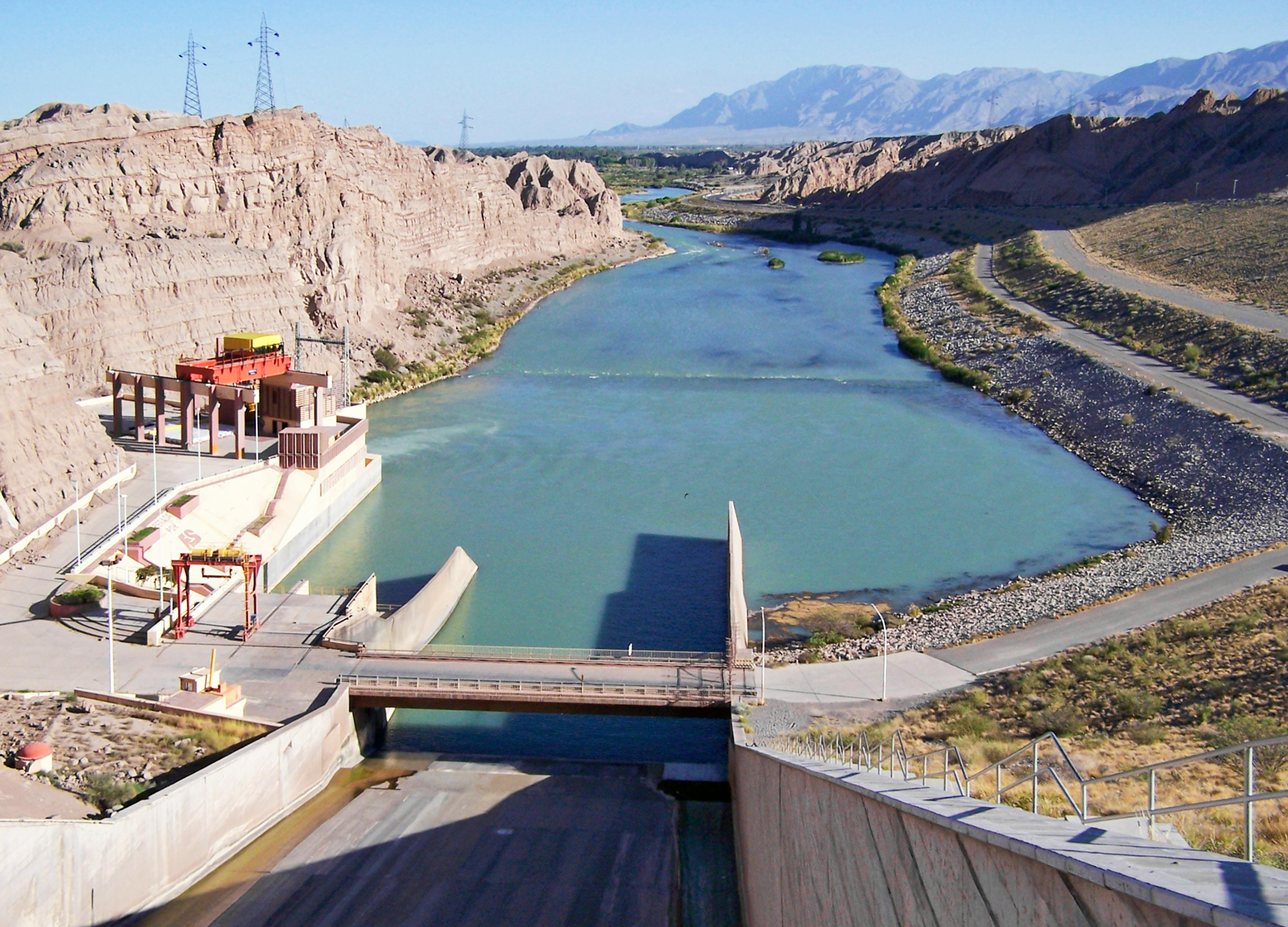 Discover the stunning Ullum Dam and river in San Juan, Argentina, surrounded by rocky landscapes.