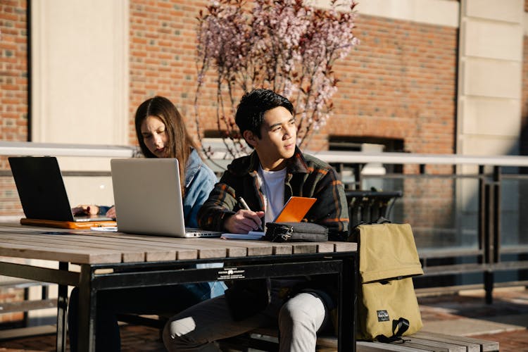 Man And Woman Studying Together 