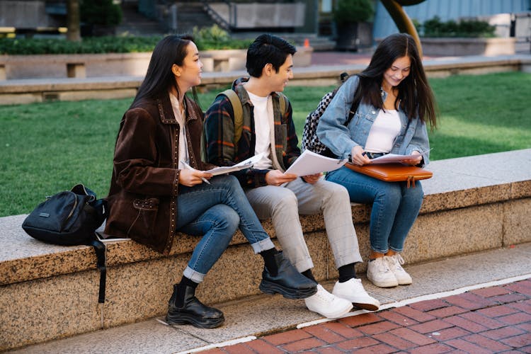 Students Sitting Outside Studying 