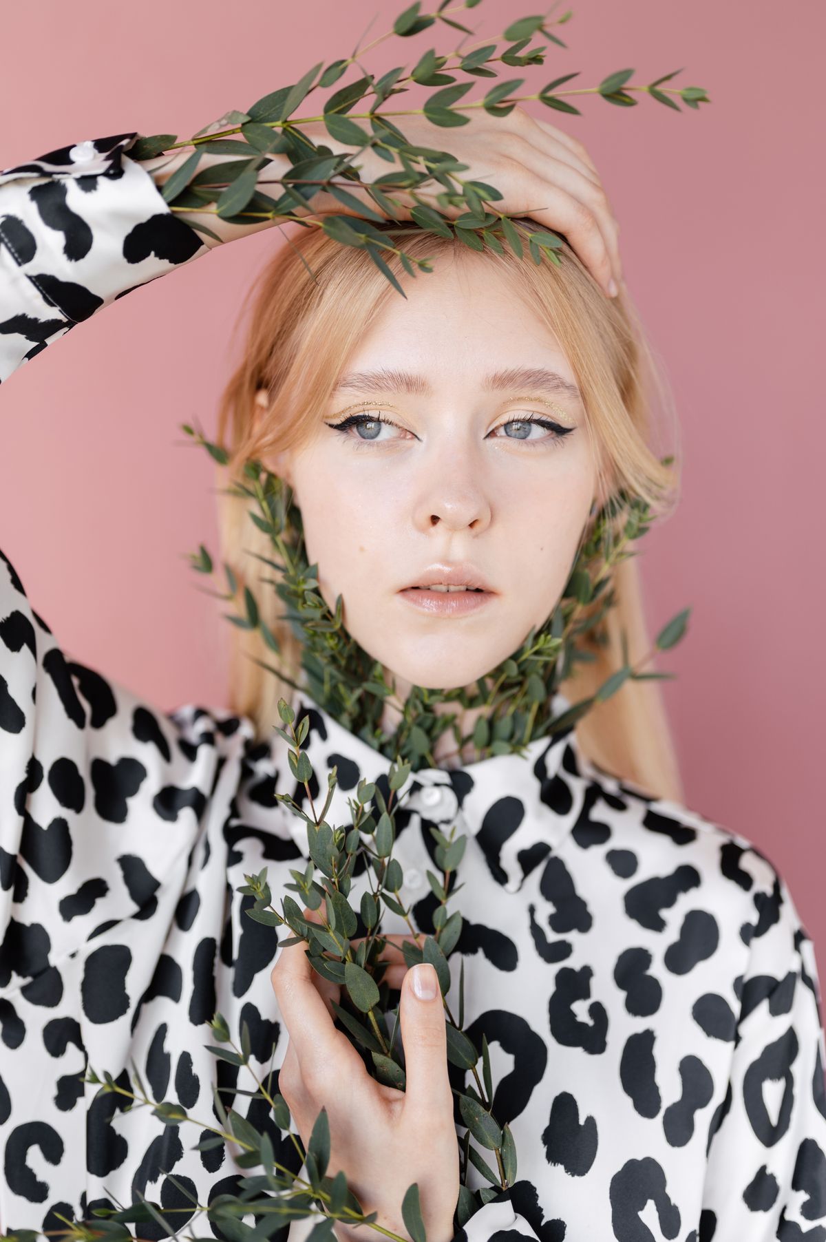 A beautiful woman in a black-and-white leopard-print top — graphic animal print