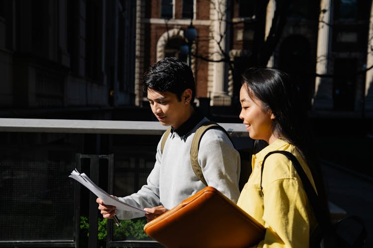 Students With Backpacks Walking City Street