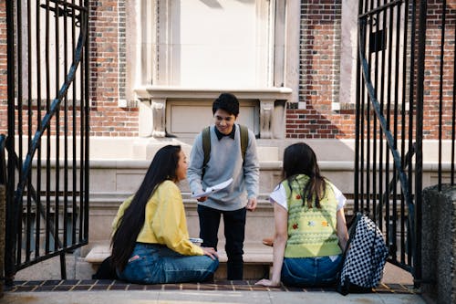 Young Students Grouping Together