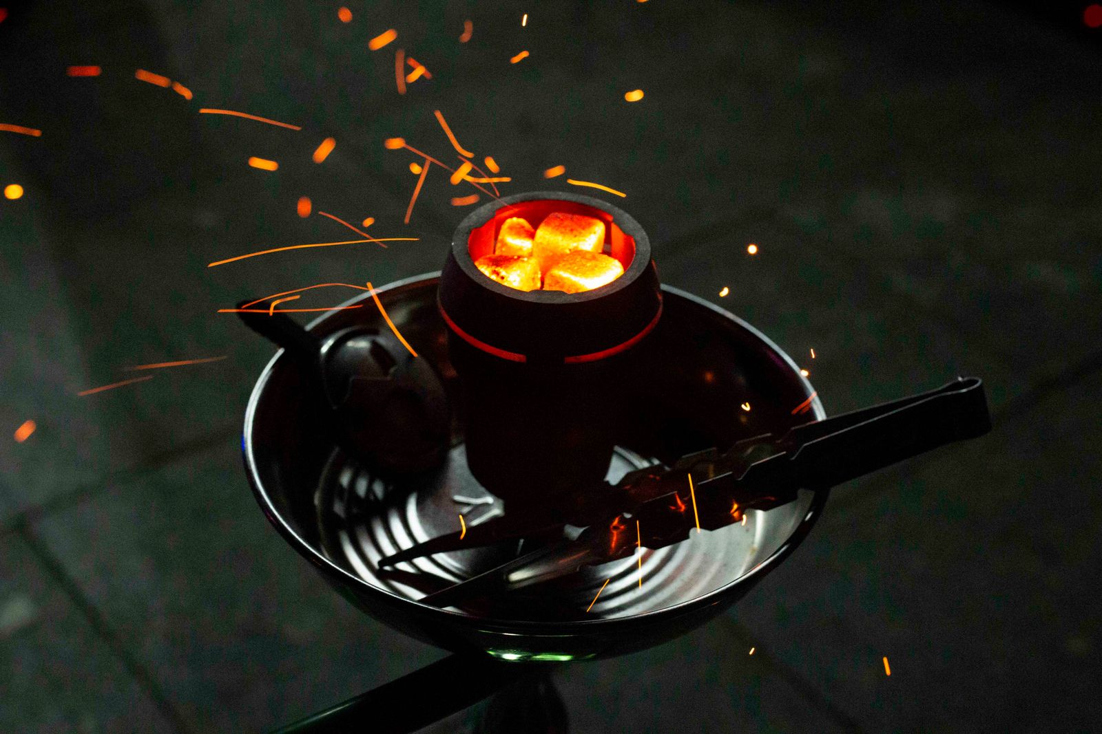 Glowing hookah coals — the heart of our menu