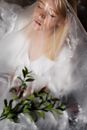 Woman in White Dress Standing Beside Green Plant